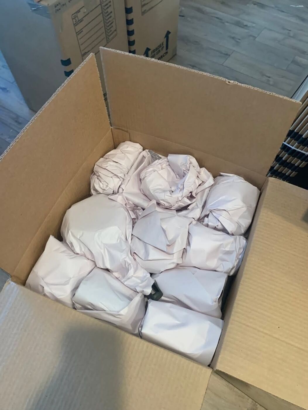 Careful packing services with paper-wrapped fragile items — Dallas–Fort Worth movers
