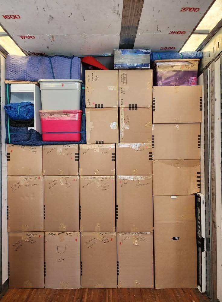 Moving truck fully packed with labeled boxes floor to ceiling — Dallas residential movers
