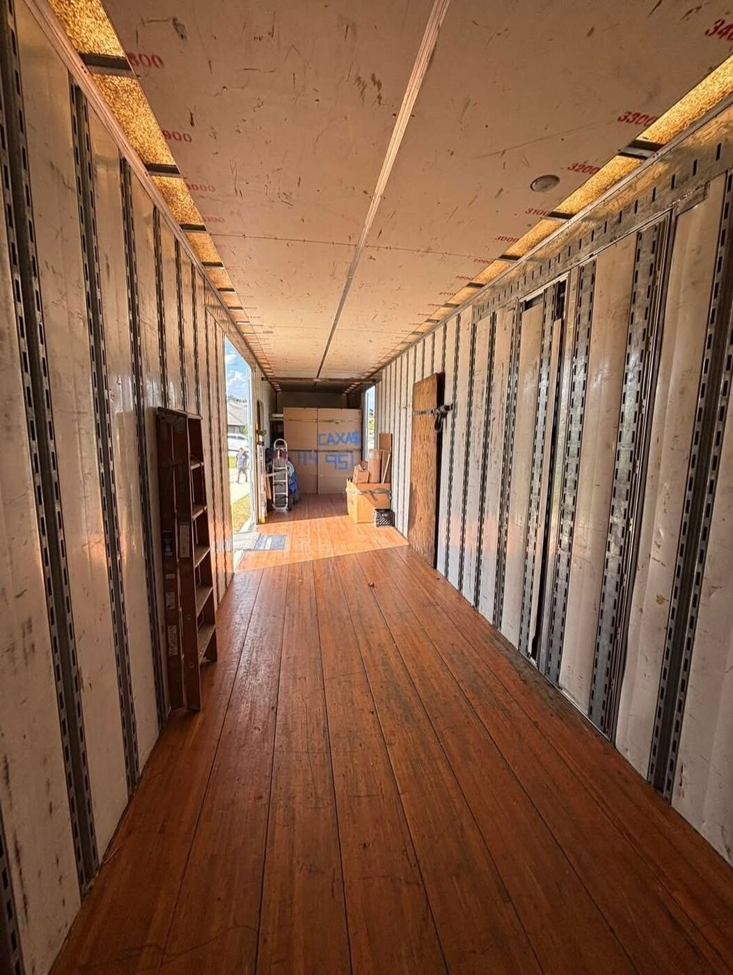 Empty large moving truck interior full-length view ready to load for commercial or residential move — One World Van Lines DFW, Texas