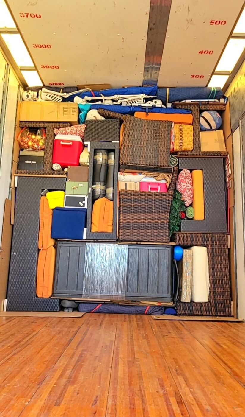 Moving truck packed with patio wicker furniture sets, cooler, outdoor rugs and specialty items — One World Van Lines Kyle, TX Greater Austin professional movers