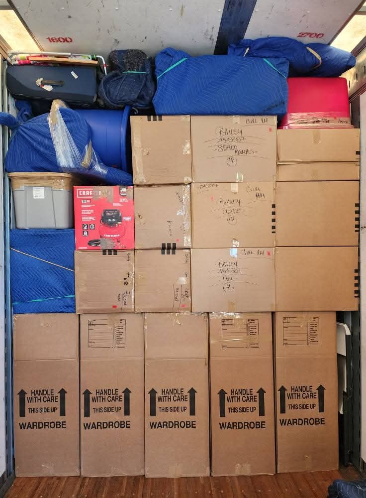 Moving truck with wardrobe Handle-With-Care boxes, Craftsman air compressor box and hand-labeled household boxes — One World Van Lines Cedar Hill, TX DFW Metroplex professional movers