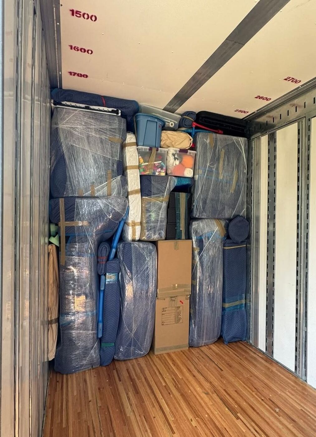 Packed moving truck interior stacked with household goods — DFW movers