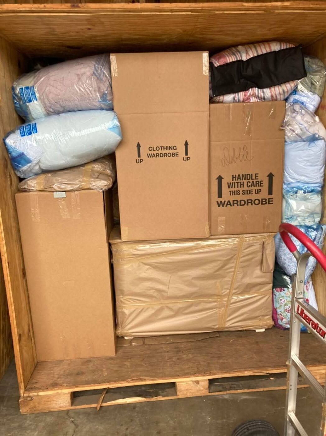 Secure storage vault unit with wardrobe boxes — Dallas–Fort Worth storage movers